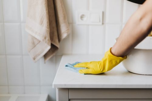 Person cleaning the bathroom
