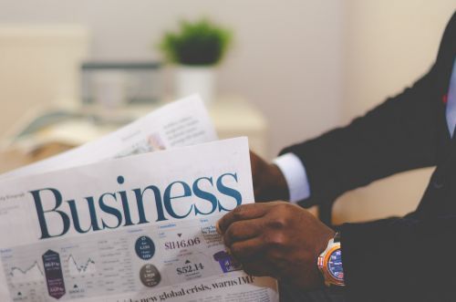 Property management expert reading a business newspaper