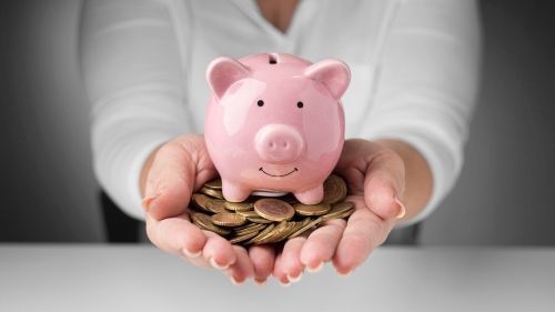 Woman holding a piggy bank